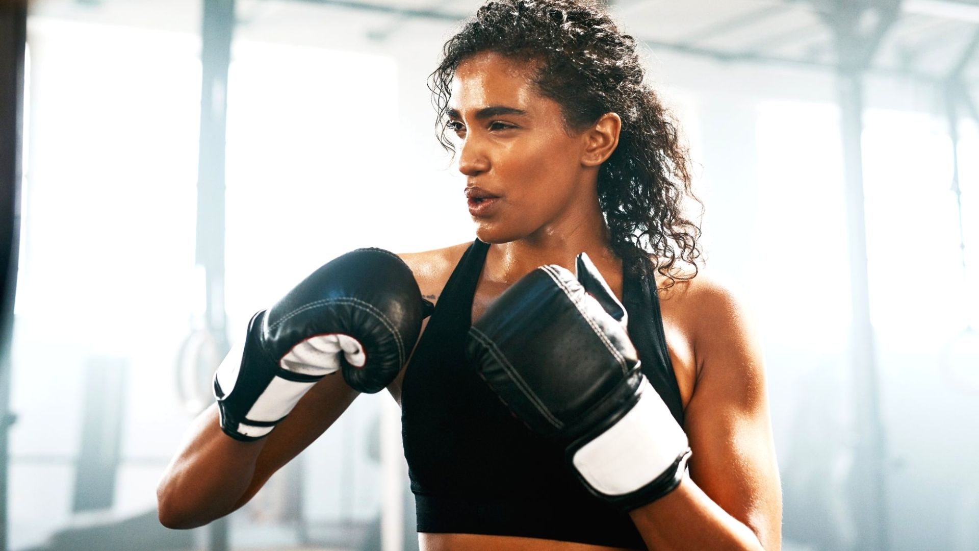 Woman Practising Boxing With Gloves