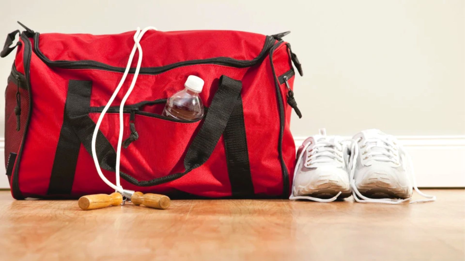 Red Gym Bag With Skipping Rope And Shoes